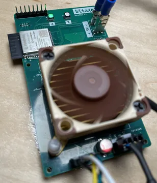 Bitaxe Max board (BM1397, v2) with its fan fitted